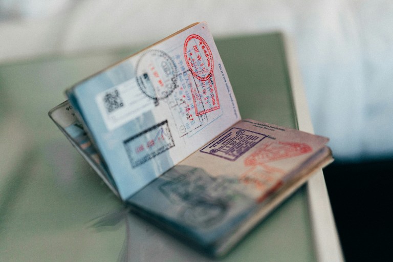 Passport with a lot of stamps, representing the myths about visas in the Netherlands.