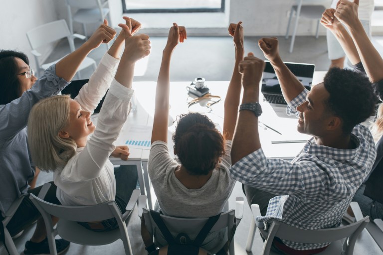 Illustration showing diverse professionals collaborating in an inclusive workplace, representing the DEI meaning in 2025.
