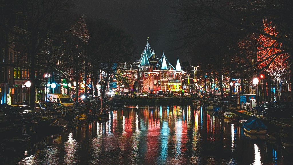 Winter in the Netherlands with the beautiful Amsterdam canals lit up during the Amsterdam Light festival.