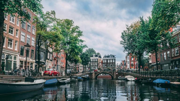 Colourful canal houses in Amsterdam – iconic Netherlands tourist attraction