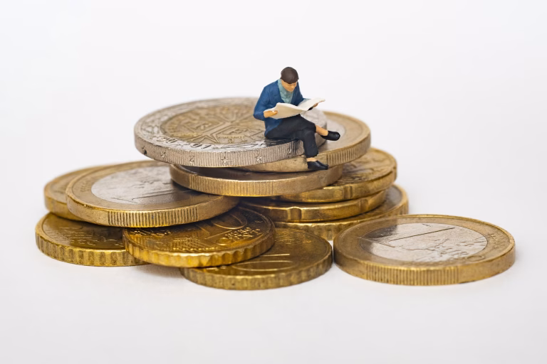 Person sitting on euros, representing the average salary in the Netherlands.