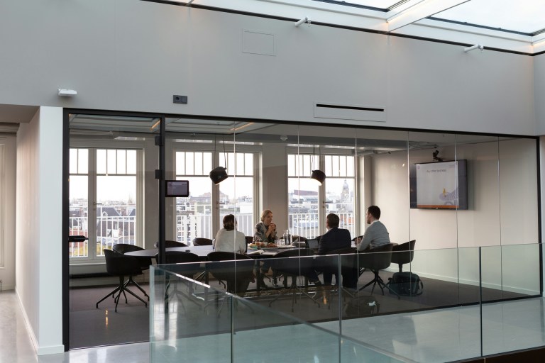 A business meeting representing international recruitment services.