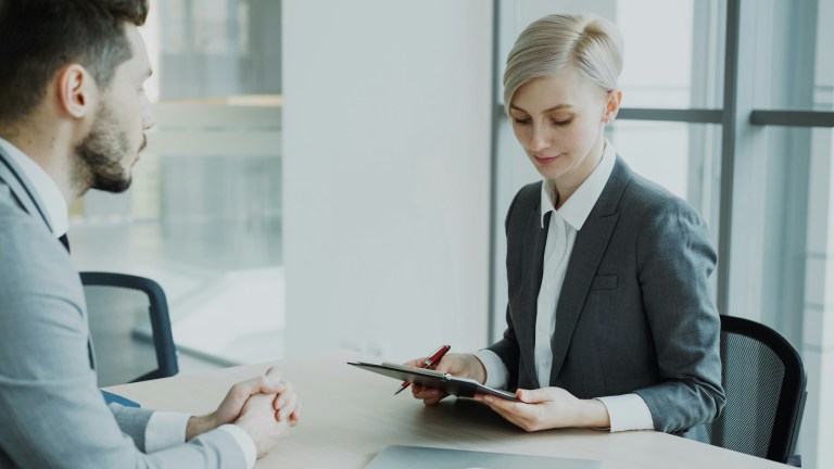 Recruiter having an interview representing what is talent acquisition in the modern sense.